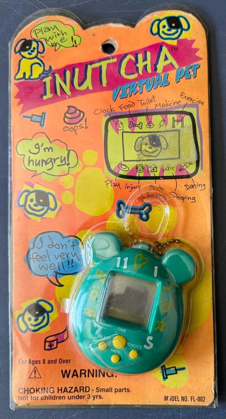 Vintage Inutcha virtual pet electronic toy model FL-002 Green.